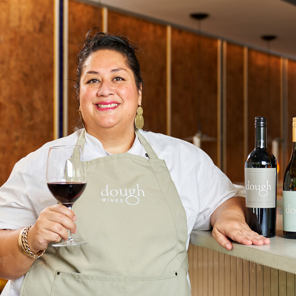 Chef Ayesha Nurdjaja - with glass of wine